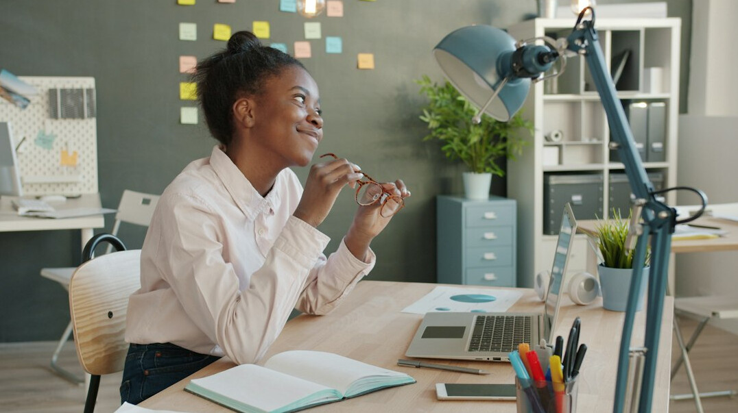 woman stretching at desk